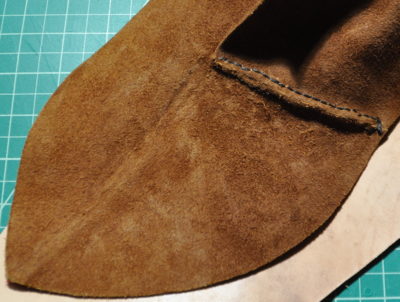 inside-out shoe showing signs of external embroidery