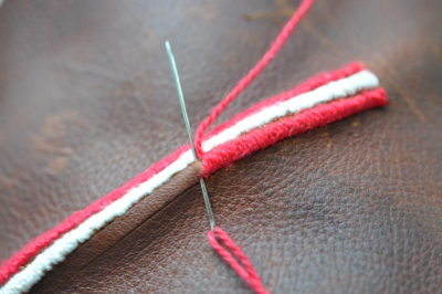 needle going through leather