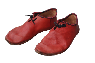 a pair of dyed-red leather turnshoes