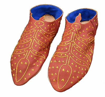 red shoes with yellow embroidered leaves